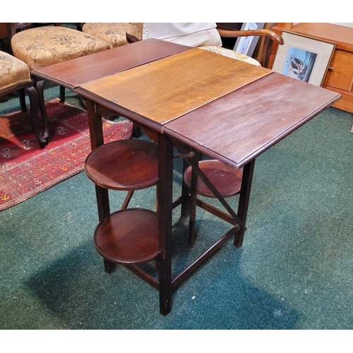 257 - A VINTAGE DROP-LEAF CAKE/SERVING TABLE, with drop leaves to the front & back & a pair of collapsible... 