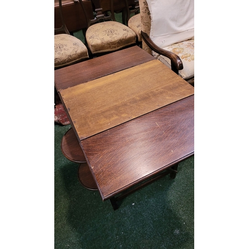 257 - A VINTAGE DROP-LEAF CAKE/SERVING TABLE, with drop leaves to the front & back & a pair of collapsible... 