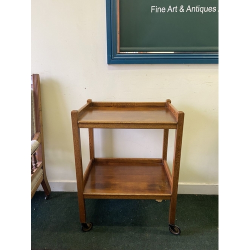 263 - A FINE TWO TIER RECONDITIONED TEA TROLLEY, with three quarter gallery to top and undertier, standing... 