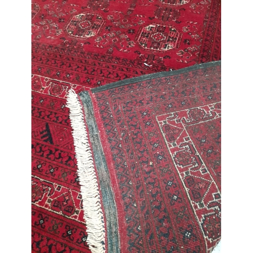 271 - AN EXCELLENT HAND-KNOTTED AFGHAN KUNDUZ RUG, with central repeat geometric pattern surrounded by mul... 