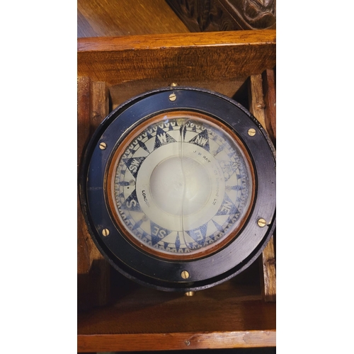 273 - A VINTAGE CASED MARINE CHRONOMETER, the dial with ‘Repaired by J. W. Ray & Co. London. Ltd. Case dim... 