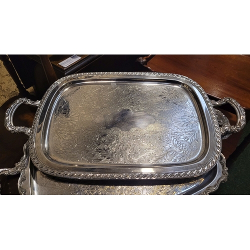 276 - TWO SILVER PLATED SERVING TRAYS, one with maker’s name to the base; made in Canada. Both with simila... 