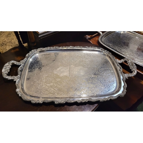 276 - TWO SILVER PLATED SERVING TRAYS, one with maker’s name to the base; made in Canada. Both with simila... 