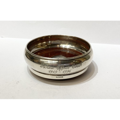 281 - A SMALL SILVER WINE COASTER, Hallmarked Maker W I Broadway & Co, Birmingham, c.1994. Silver with har... 