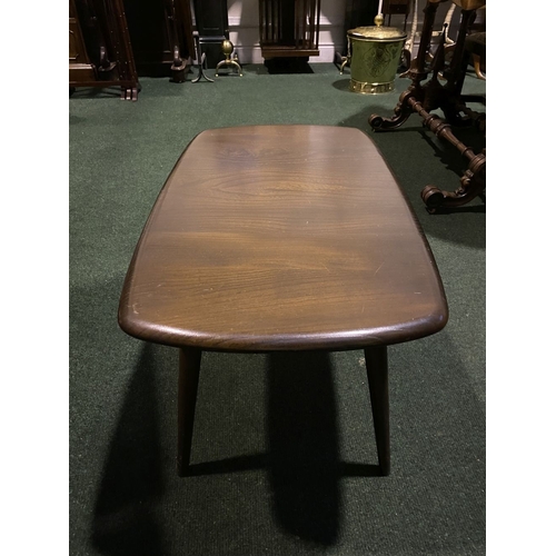 288 - A VINTAGE AUTHENTIC ERCOL COFFEE TABLE, with splayed legs, complete with Ercol label to underside. D... 