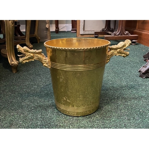 289 - A BRASS TWO HANDLED ICE BUCKET, with dragon handles to sides, beaded detail to top and embossed bind... 