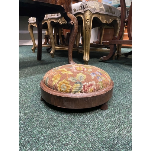 292 - A CIRCULAR MAHOGANY NEEDLEPOINT FOOTSTOOL, dimensions: 27.5cm diameter x 10cm high approx