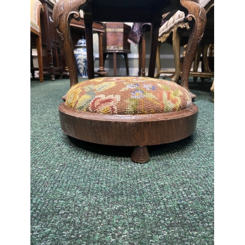 292 - A CIRCULAR MAHOGANY NEEDLEPOINT FOOTSTOOL, dimensions: 27.5cm diameter x 10cm high approx