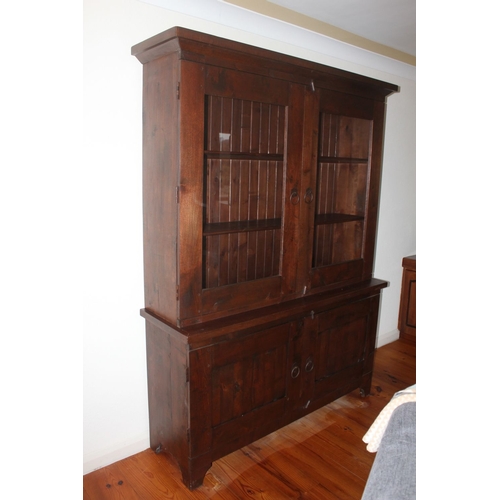 312 - AN ANTIQUE WELSH OAK TWO DOOR CUPBOARD, with raised cornice above two glass panelled doors revealing... 