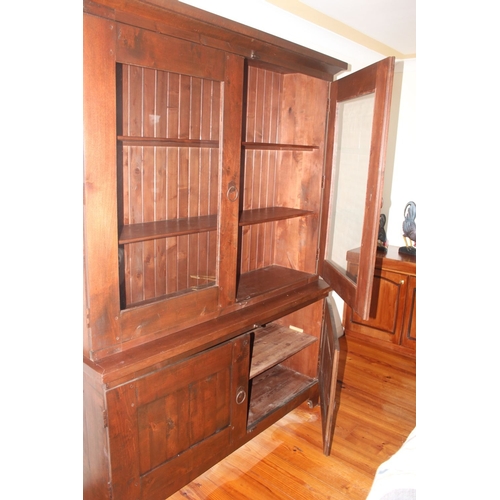 312 - AN ANTIQUE WELSH OAK TWO DOOR CUPBOARD, with raised cornice above two glass panelled doors revealing... 