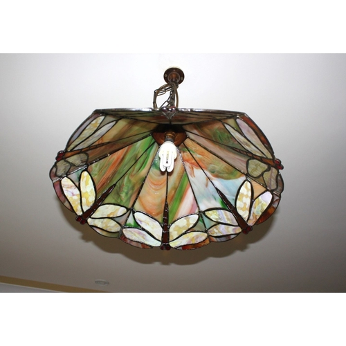 314 - A VINTAGE TIFFANY STYLE STAINED GLASS HANGING LAMPSHADE, the shade having six panels to top and base... 