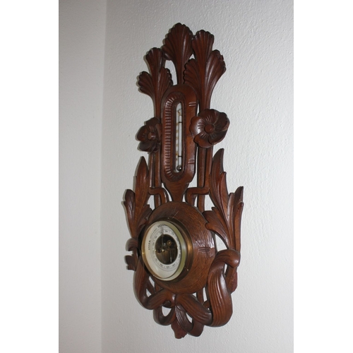 315 - A VINTAGE CARVED DUTCH VERANDERLIJK BAROMETER, with thermometer to top surrounded by intricate flora... 