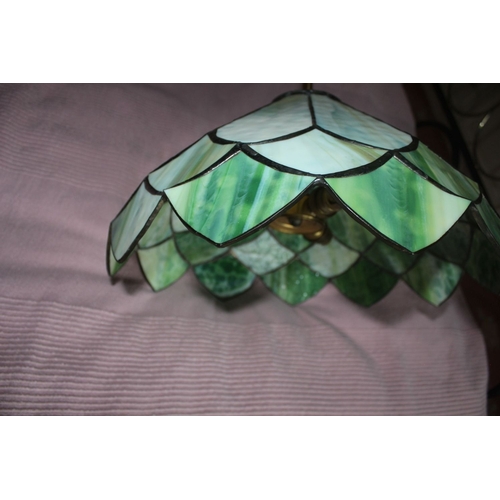 334 - A BEAUTIFUL STAINED GLASS HANGING LAMPSHADE, the shade having panels of coloured green glass, dimens... 