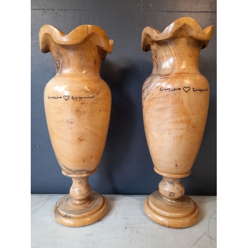 352 - A PAIR OF VERY NICELY TURNED OLIVE WOOD VASES, inscribed to both with Arabic inscription. Dimensions... 