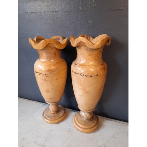 352 - A PAIR OF VERY NICELY TURNED OLIVE WOOD VASES, inscribed to both with Arabic inscription. Dimensions... 