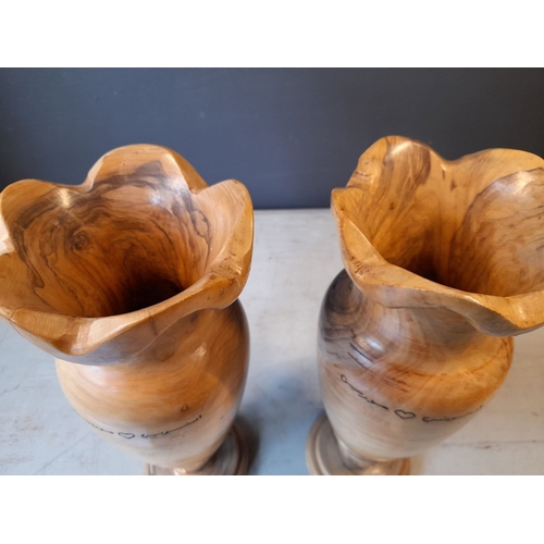 352 - A PAIR OF VERY NICELY TURNED OLIVE WOOD VASES, inscribed to both with Arabic inscription. Dimensions... 