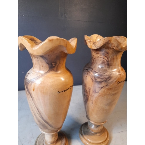 352 - A PAIR OF VERY NICELY TURNED OLIVE WOOD VASES, inscribed to both with Arabic inscription. Dimensions... 