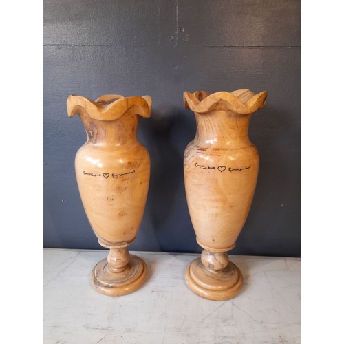 352 - A PAIR OF VERY NICELY TURNED OLIVE WOOD VASES, inscribed to both with Arabic inscription. Dimensions... 