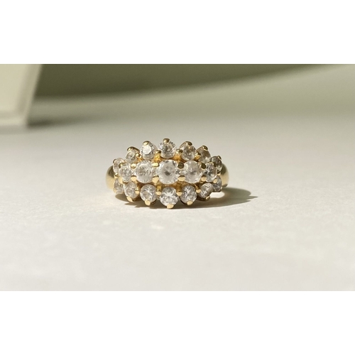 374 - A STUNNING 14CT YELLOW GOLD TRIPLE ROW CLUSTER RING, with five graduated clear gemstones to centre, ... 