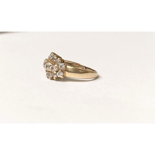 374 - A STUNNING 14CT YELLOW GOLD TRIPLE ROW CLUSTER RING, with five graduated clear gemstones to centre, ... 