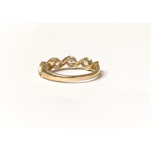 375 - A BEAUTIFUL 14CT GOLD FOUR STONE RING, four round cut clear gemstones in intricate twist setting, sl... 