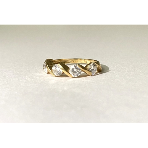 375 - A BEAUTIFUL 14CT GOLD FOUR STONE RING, four round cut clear gemstones in intricate twist setting, sl... 