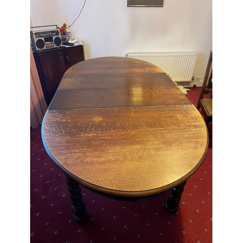 376 - A GOOD OVAL MAHOGANY EXTENDING DINING TABLE, on barley twist leg and bun feet. Dimensions: 150cm dee... 