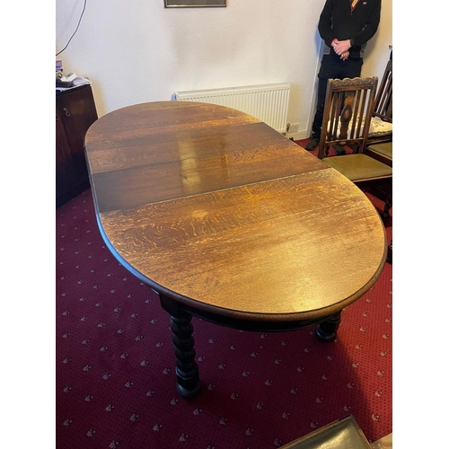 376 - A GOOD OVAL MAHOGANY EXTENDING DINING TABLE, on barley twist leg and bun feet. Dimensions: 150cm dee... 