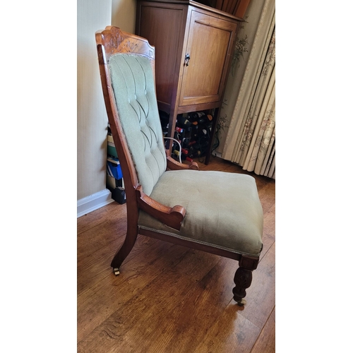 46 - A GOOD QUALITY EDWARDIAN NURSING / LOW RISE CHAIR, with button back & carved detail to the frame. Ra... 