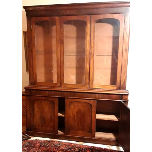 48 - A LARGE THREE BAY VICTORIAN GLAZED BOOKCASE CABINET, superb colour and condition to the wood. The to... 