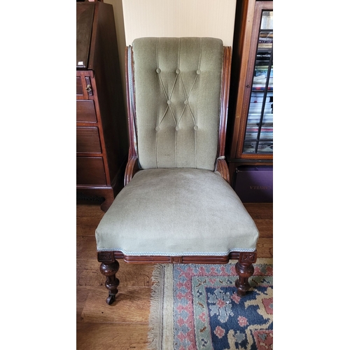 49 - A GOOD QUALITY EDWARDIAN NURSING / LOW RISE CHAIR, with buttoned back & carved detail to the frame. ... 