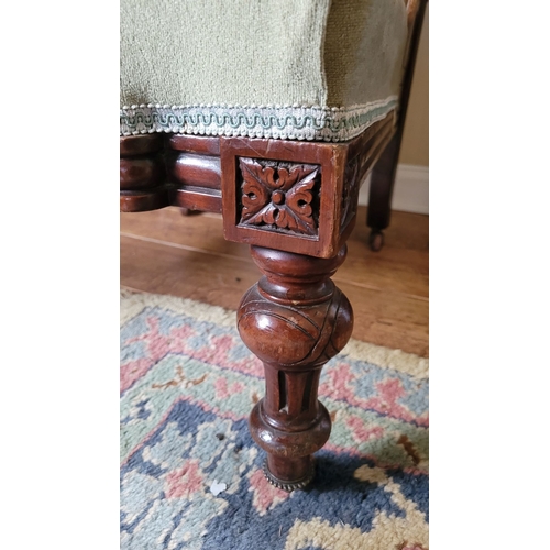 49 - A GOOD QUALITY EDWARDIAN NURSING / LOW RISE CHAIR, with buttoned back & carved detail to the frame. ... 