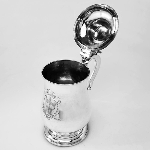 5 - AN EXCELLENT 18TH CENTURY IRISH OVERSIZED SILVER TANKARD, the double c-scroll handle with design in ... 