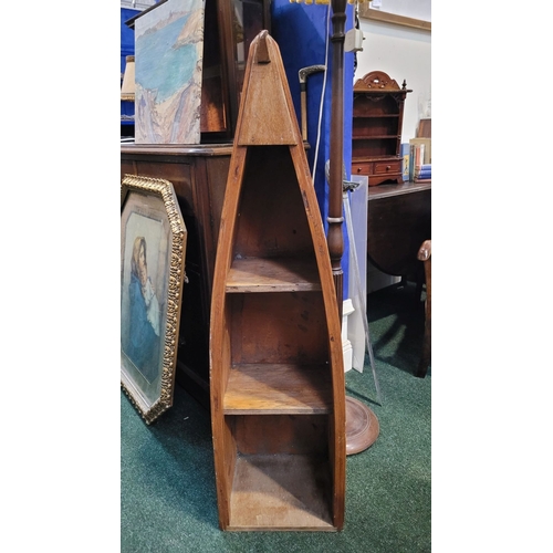 57 - A LOVELY PINE BOAT-SHAPED OPEN FLOOR BOOKCASE OR DISPLAY CABINET, of graduated form; having three op... 