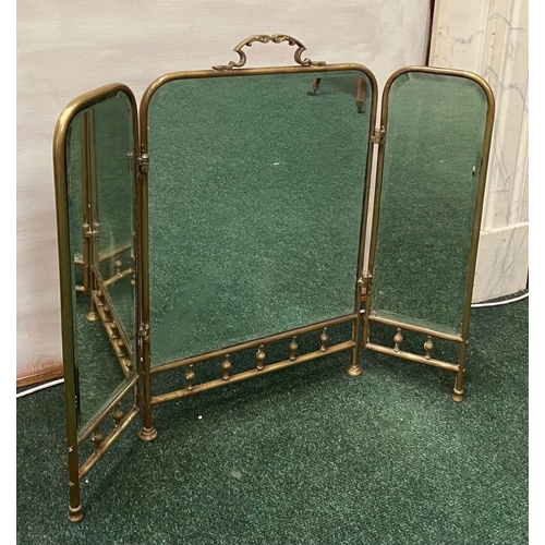 63 - A 19TH CENTURY BRASS THREE PANEL MIRRORED FIRESCREEN, with arched mirrors, ornate handle to central ... 