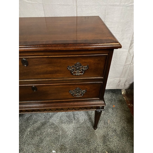 64 - A FINE MAHOGANY TWO DRAWER CHEST, the crossbanded top with molded edge, above two panelled drawers w... 