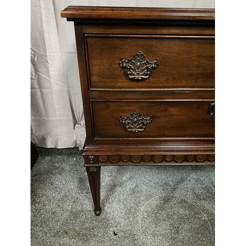 64 - A FINE MAHOGANY TWO DRAWER CHEST, the crossbanded top with molded edge, above two panelled drawers w... 