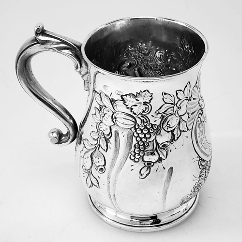 68 - A VERY DECORATIVE IRISH GEORGE II SILVER CHASED MUG, Hallmarked maker William Townsend, Dublin, c.17... 