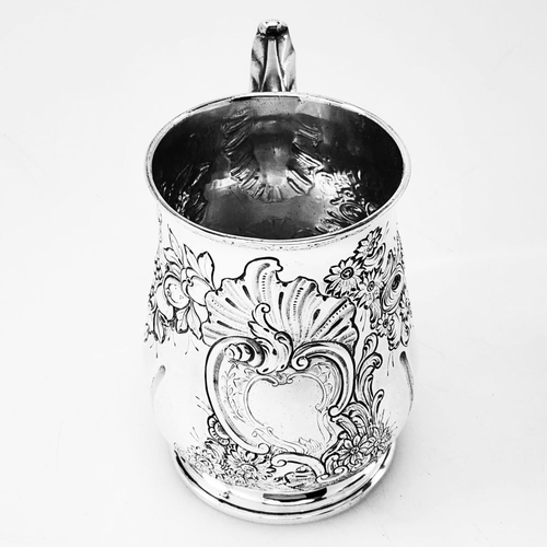 68 - A VERY DECORATIVE IRISH GEORGE II SILVER CHASED MUG, Hallmarked maker William Townsend, Dublin, c.17... 