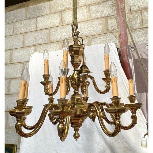 91 - AN EXCELLENT HEAVY BRASS TWO TIER CHANDELIER, the top tier having four arms, with scroll armrests an... 