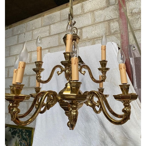 91 - AN EXCELLENT HEAVY BRASS TWO TIER CHANDELIER, the top tier having four arms, with scroll armrests an... 