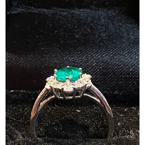 55 - A STRIKING ART DECO STYLE 18CT WHITE GOLD COLUMBIAN EMERALD AND DIAMOND CLUSTER RING, with central o... 