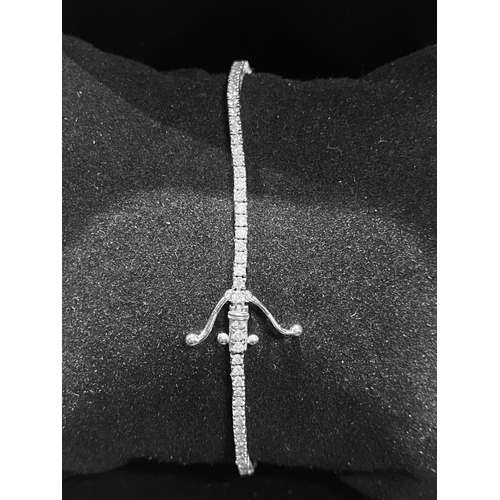 132 - A FANTASTIC 18CT WHITE GOLD DIAMOND TENNIS BRACELET, with 2.20cts total diamonds, complete with safe... 