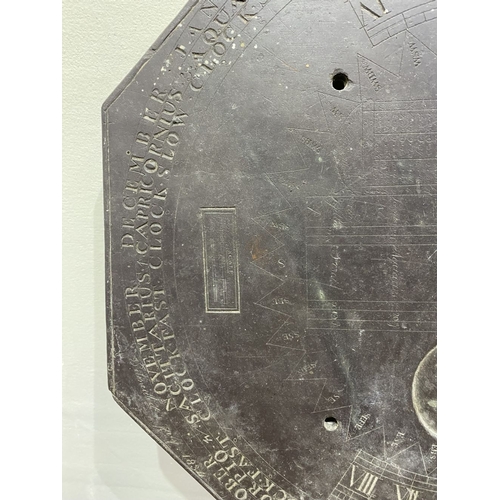 105 - A RARE 19TH CENTURY SUNDIAL PLATE, the octagonal slate engraved with sunburst design to centre, with... 