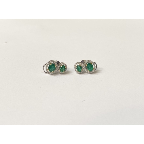 115 - A BEAUTIFUL PAIR OF HAND-AMDE 18CT WHITE GOLD EMERALD & DIAMOND EARRINGS, each with two oval cut eme... 