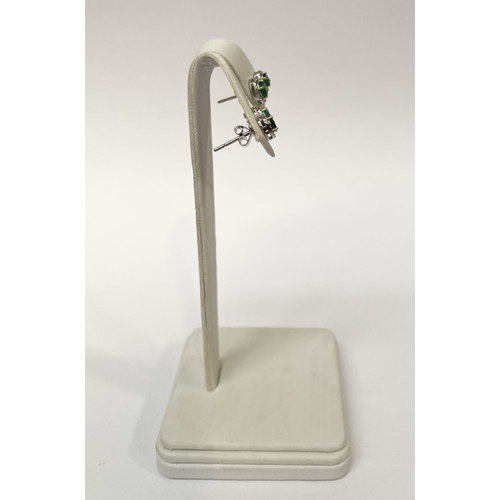 115 - A BEAUTIFUL PAIR OF HAND-AMDE 18CT WHITE GOLD EMERALD & DIAMOND EARRINGS, each with two oval cut eme... 