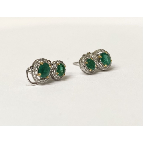 115 - A BEAUTIFUL PAIR OF HAND-AMDE 18CT WHITE GOLD EMERALD & DIAMOND EARRINGS, each with two oval cut eme... 