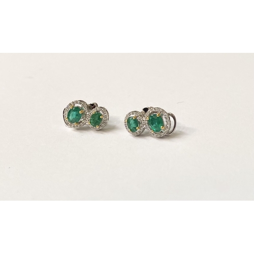 115 - A BEAUTIFUL PAIR OF HAND-AMDE 18CT WHITE GOLD EMERALD & DIAMOND EARRINGS, each with two oval cut eme... 