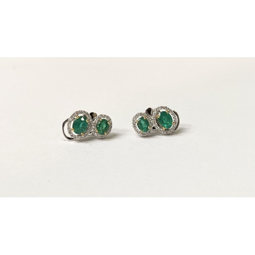 115 - A BEAUTIFUL PAIR OF HAND-AMDE 18CT WHITE GOLD EMERALD & DIAMOND EARRINGS, each with two oval cut eme... 