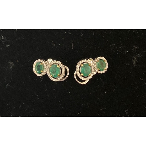 115 - A BEAUTIFUL PAIR OF HAND-AMDE 18CT WHITE GOLD EMERALD & DIAMOND EARRINGS, each with two oval cut eme... 